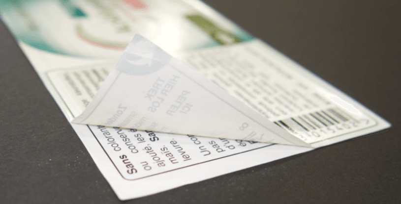 Peel and Read Label on Black Background showing French Text