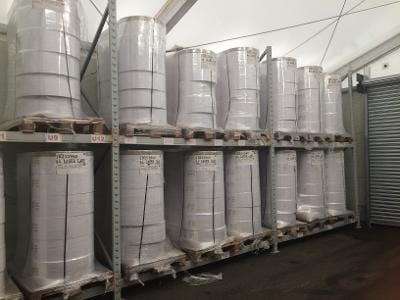 Self-Adhesive Laser Paper Stock on racking in our warehouse